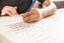 student writing in cursive